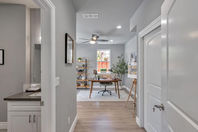 a view of a livingroom with furniture and wooden floor