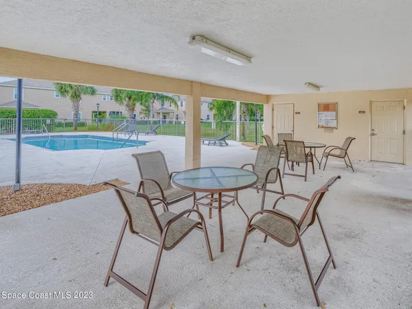 a view of house with outdoor space and sitting area
