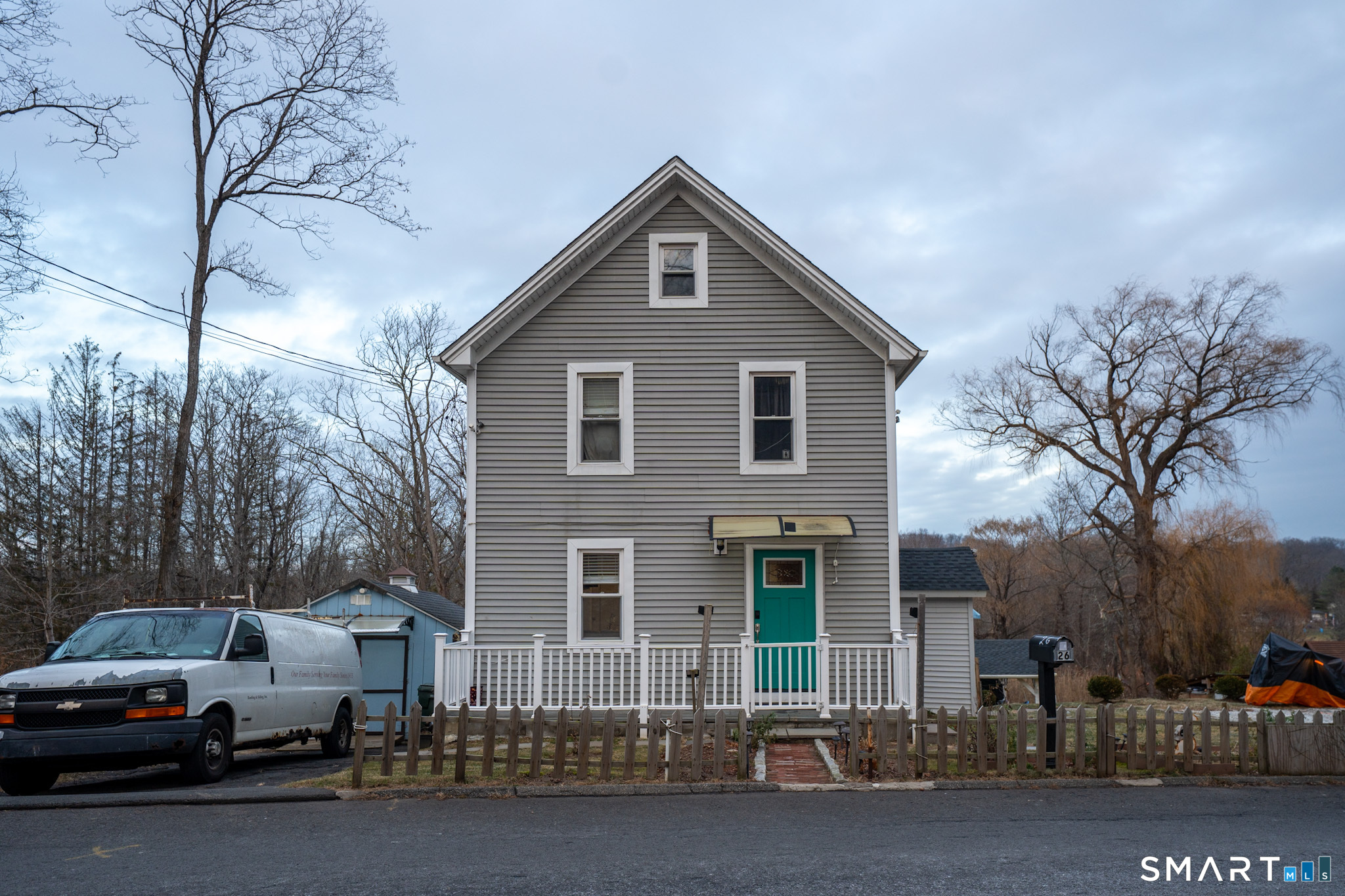 a view of a car park in front of house