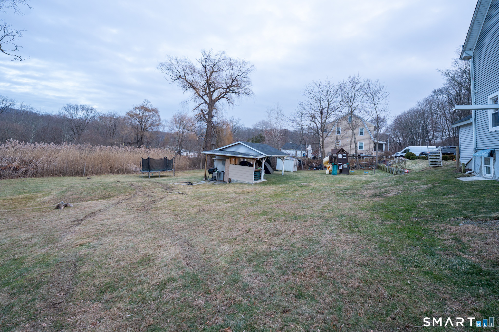 26 Mountainville Road Danbury, CT 06810 - Photo 5 of 13 a view of a outdoor space with green field and trees