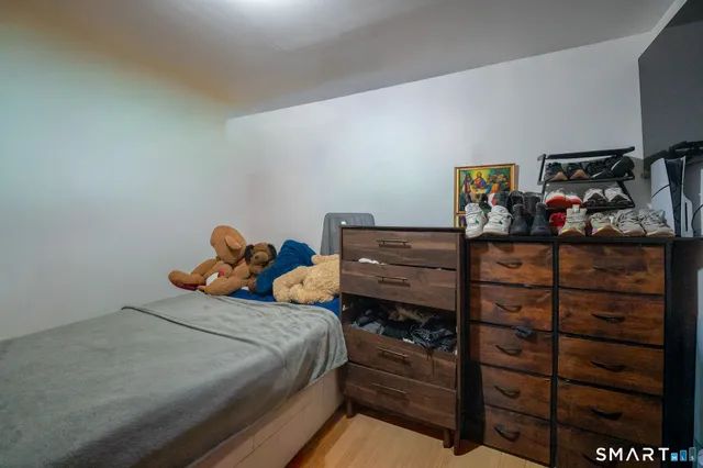 a bedroom with a bed and a closet