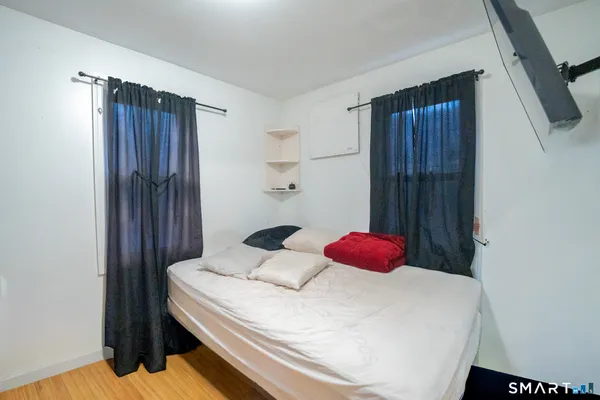 a bedroom with a bed and cabinets