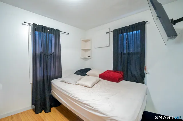 a bedroom with a bed and cabinets