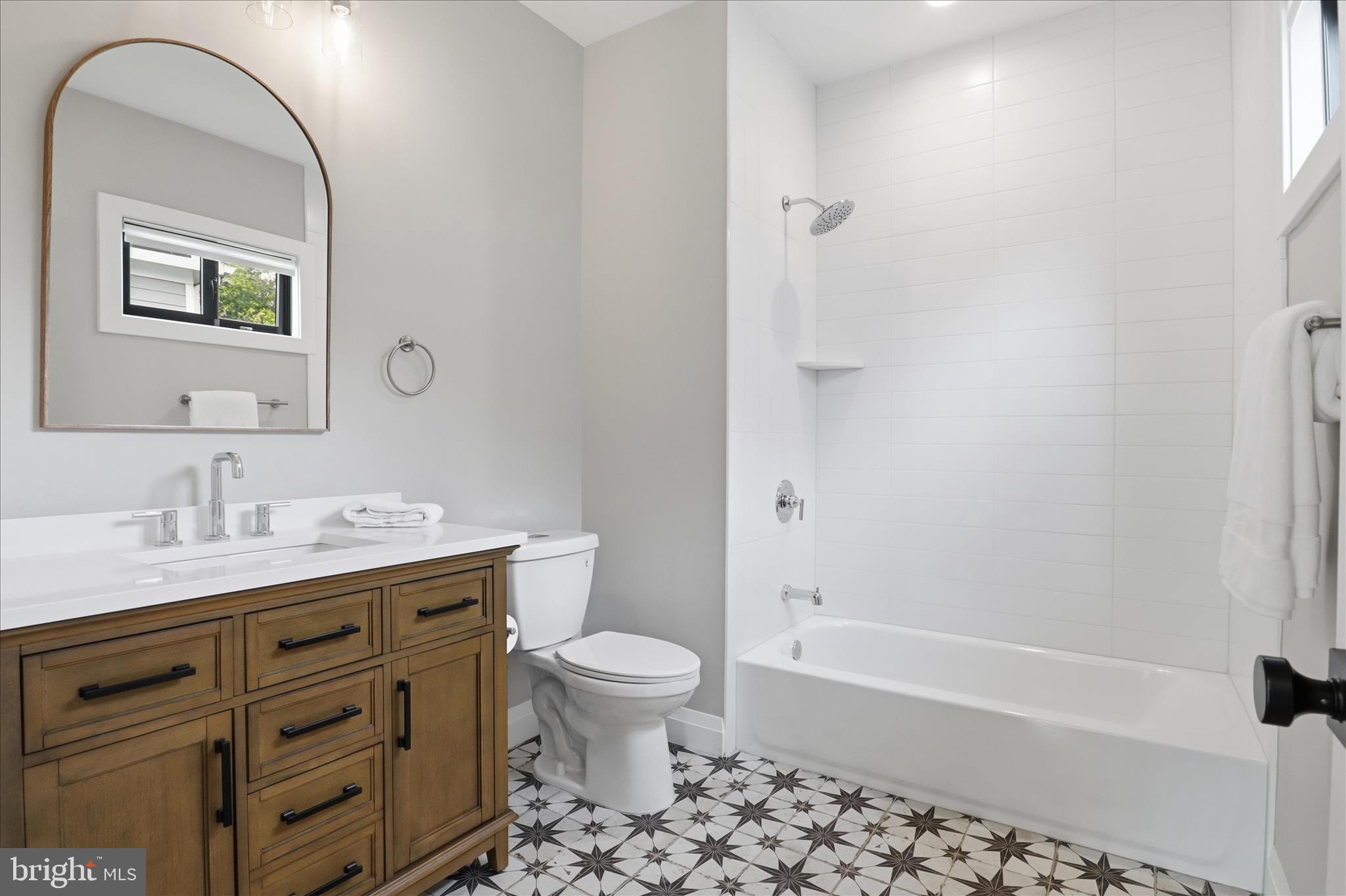 202 Branch Road Southeast Vienna, VA 22180 - Photo 33 of 59 a bathroom with a granite countertop sink a toilet and a bathtub