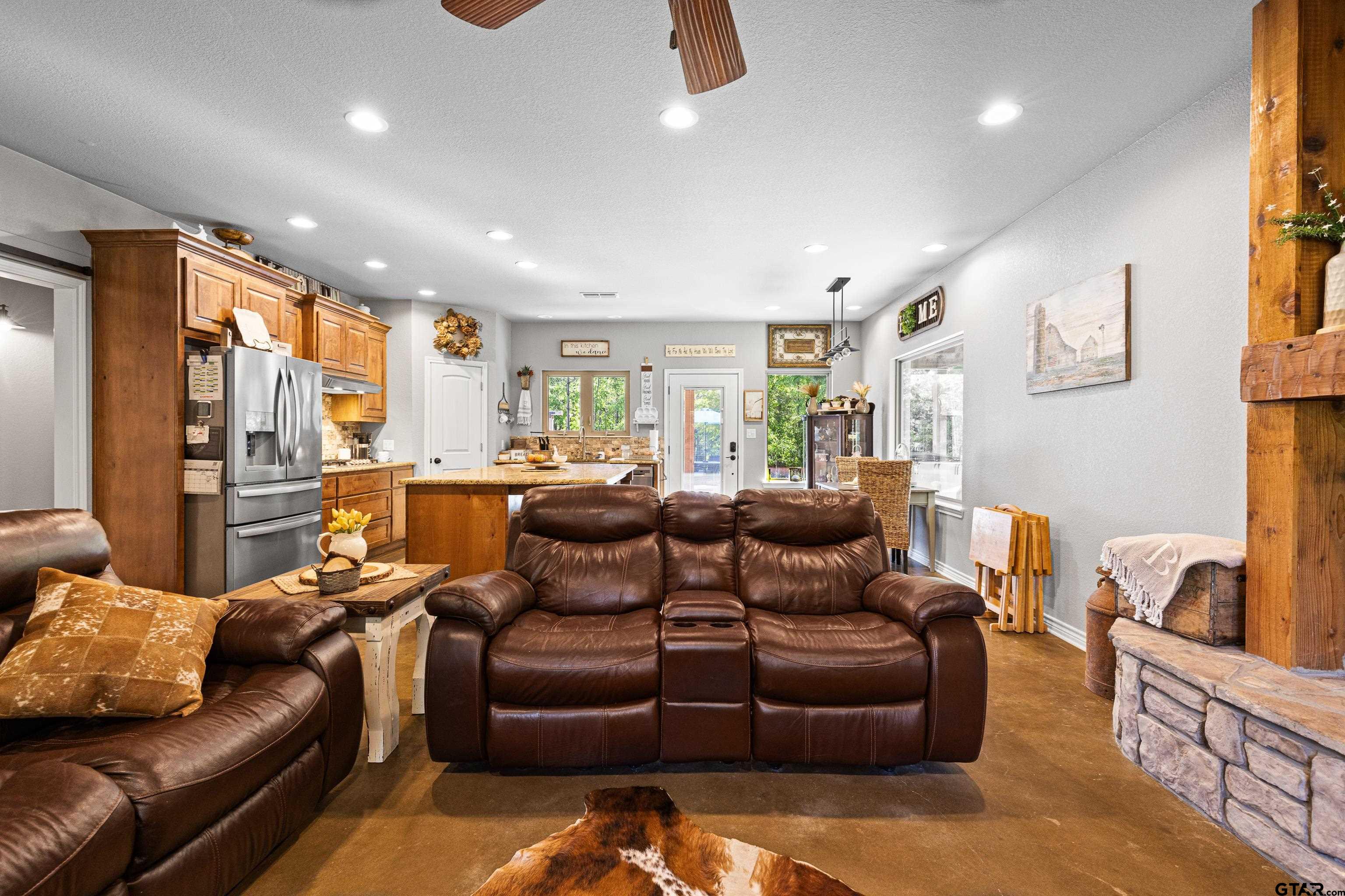 10586 Petunia Road Ore City, TX 75683 - Photo 13 of 45 a living room with furniture and a large window