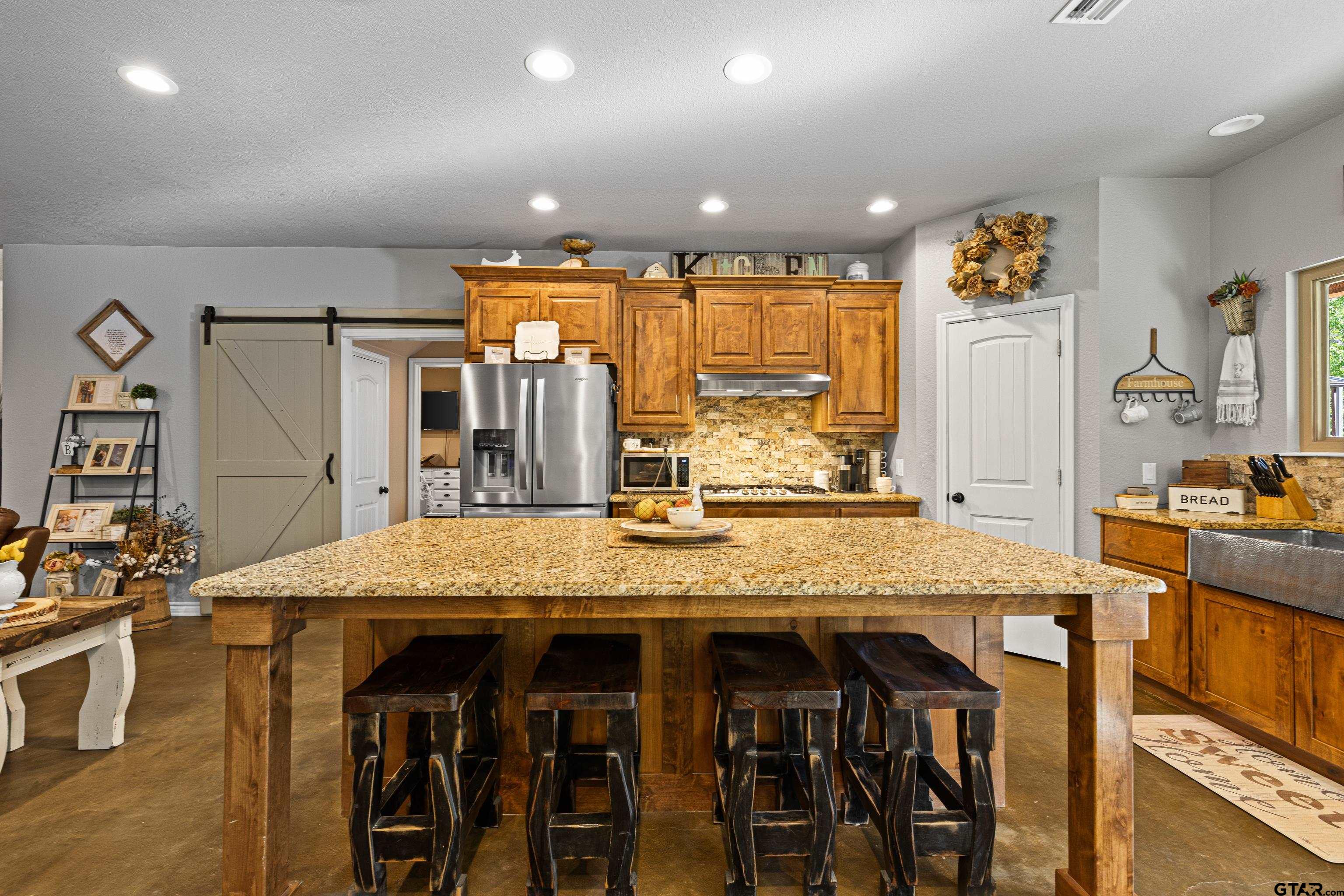 10586 Petunia Road Ore City, TX 75683 - Photo 21 of 45 a view of a center island of the kitchen