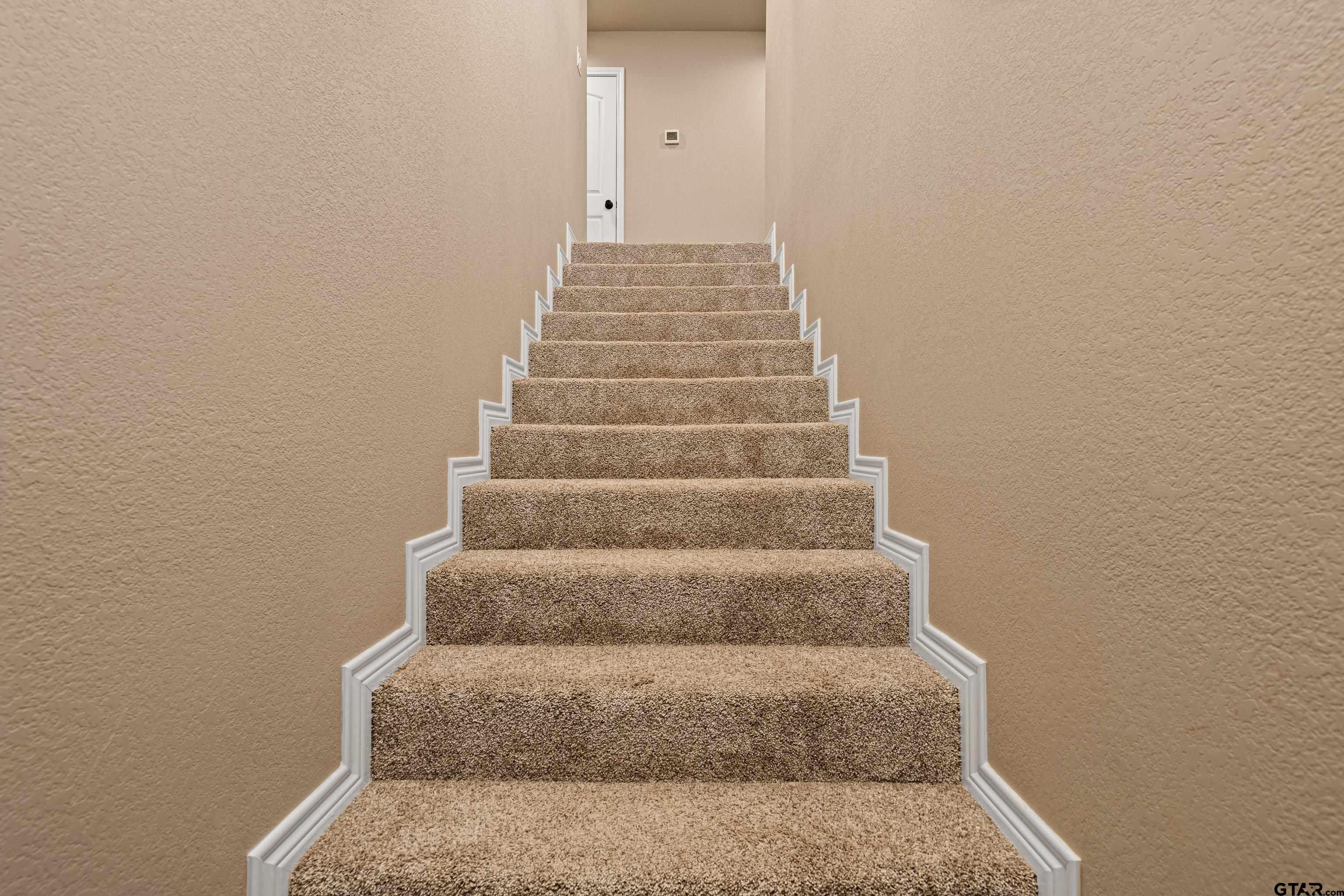 10586 Petunia Road Ore City, TX 75683 - Photo 30 of 45 a view of staircase with empty racks