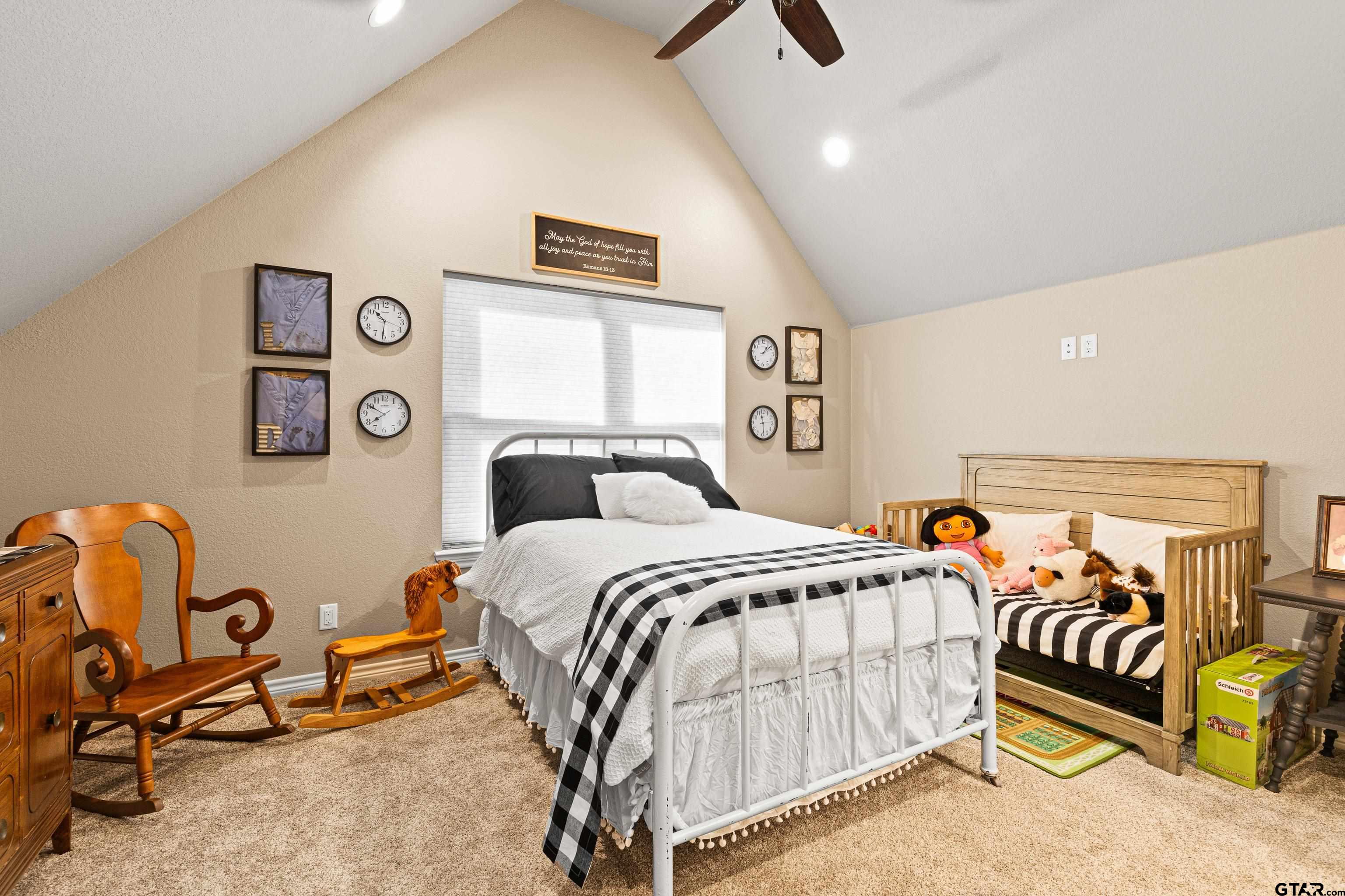 10586 Petunia Road Ore City, TX 75683 - Photo 34 of 45 a bedroom with a bed and ceiling fan