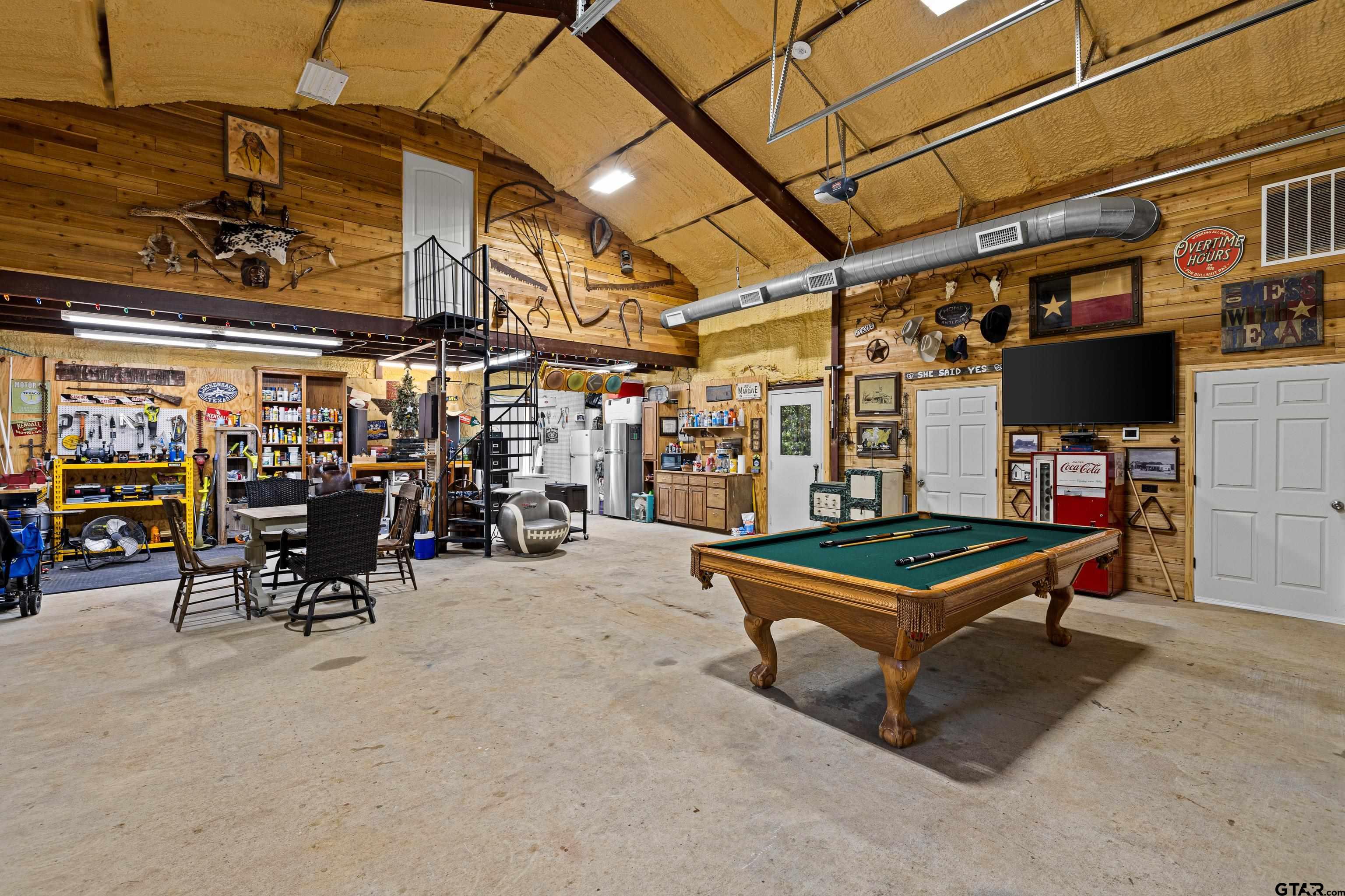 10586 Petunia Road Ore City, TX 75683 - Photo 38 of 45 a view of a storage with a table and chairs