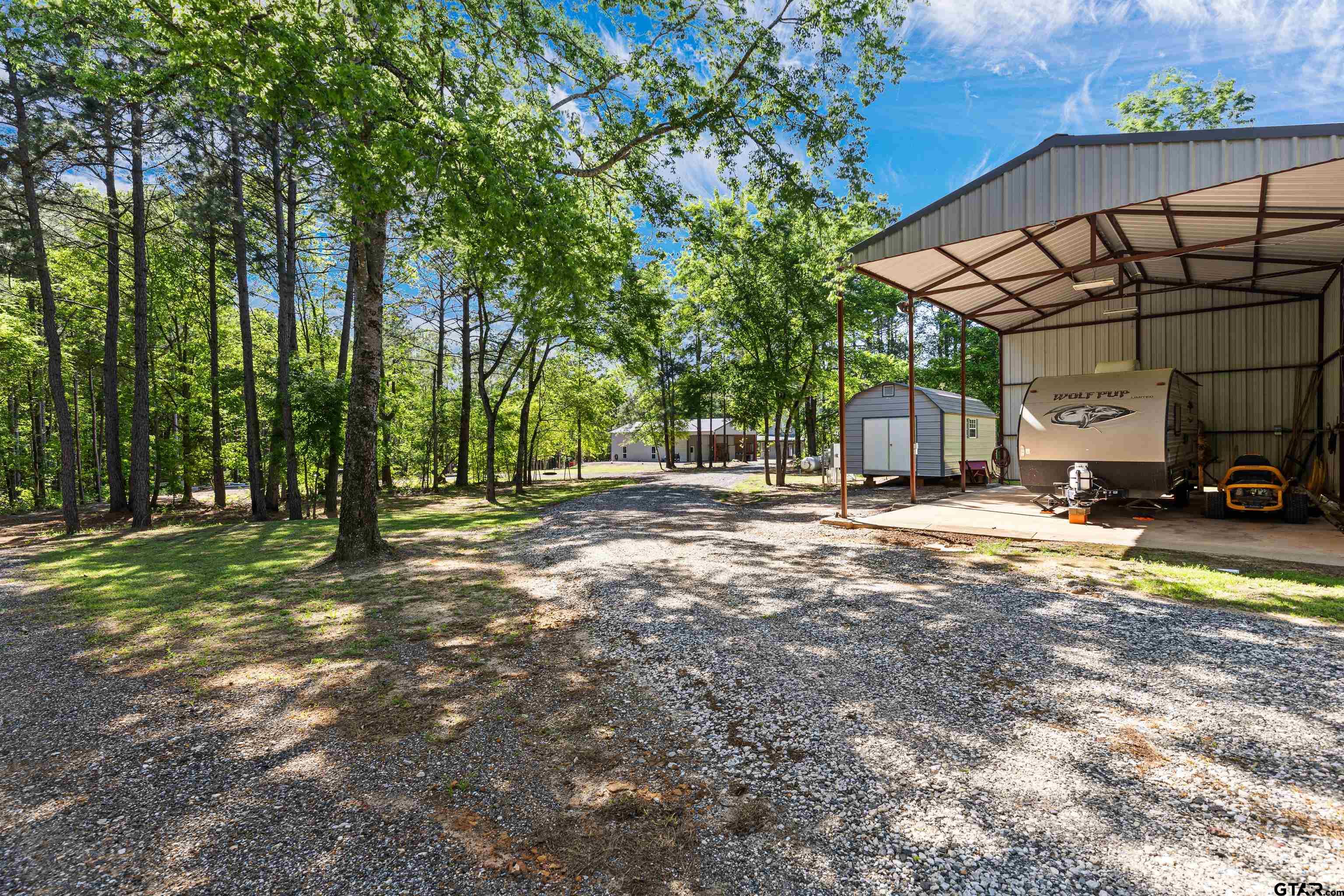 10586 Petunia Road Ore City, TX 75683 - Photo 44 of 45 a view of yard with car parked