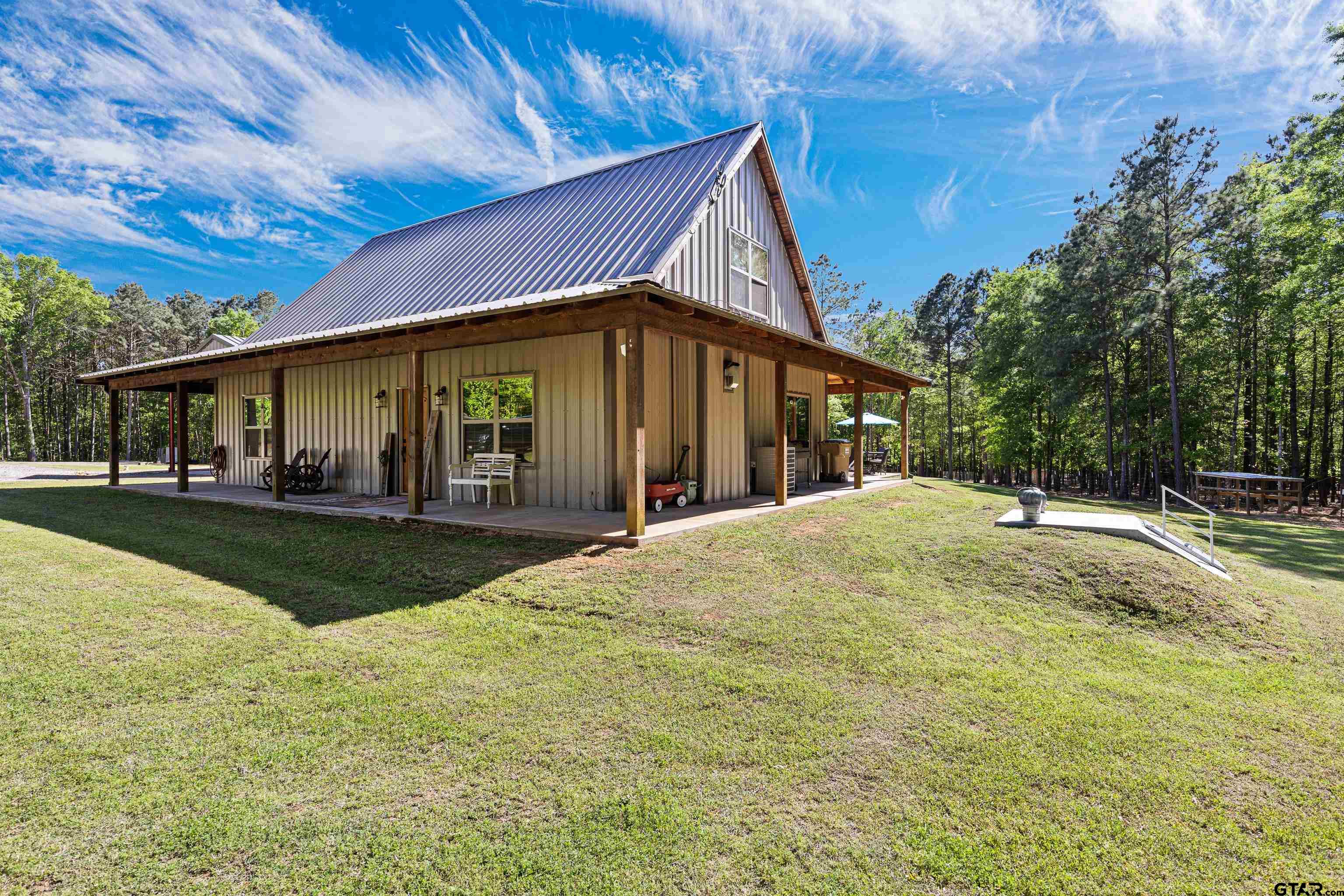 10586 Petunia Road Ore City, TX 75683 - Photo 8 of 45 a view of outdoor space yard and porch