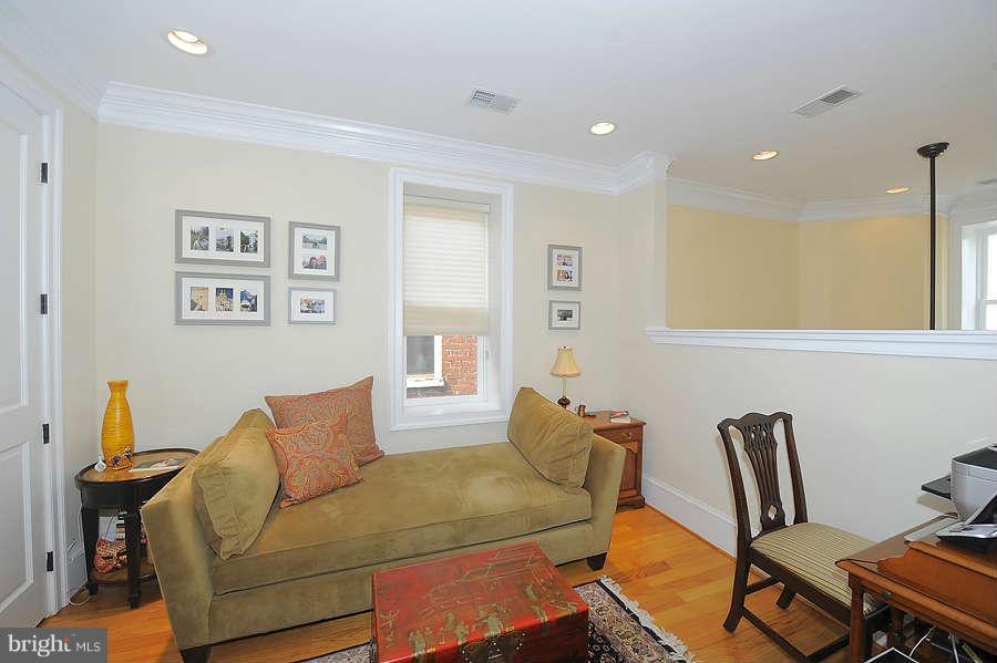 629 4th Street Northeast, Unit 3 Washington, DC 20002 - Photo 16 of 30 a living room with furniture and a window