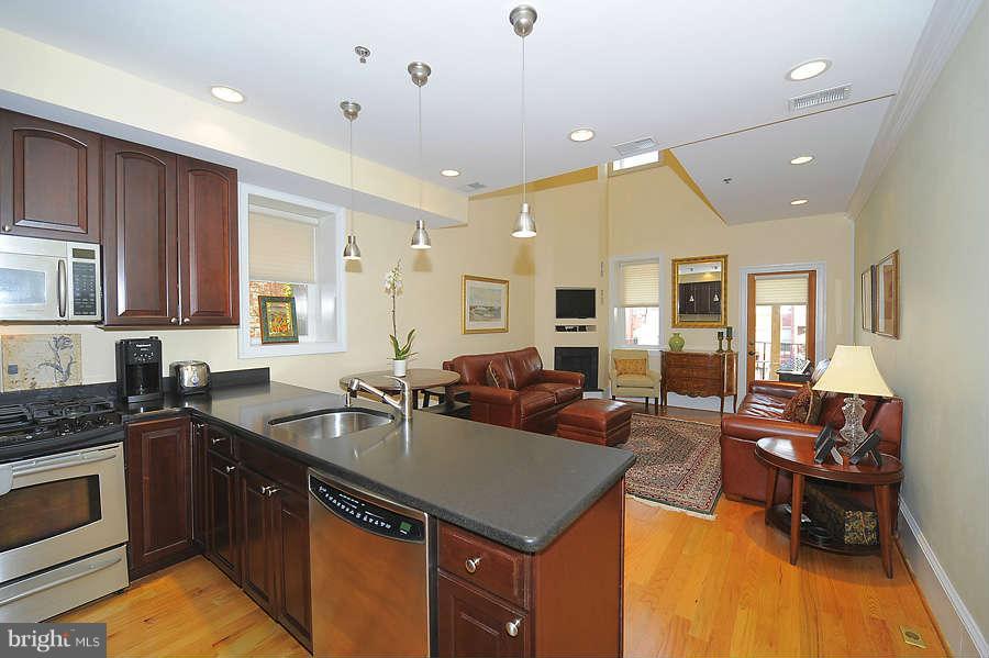 629 4th Street Northeast, Unit 3 Washington, DC 20002 - Photo 3 of 30 a kitchen with a sink stove and cabinets