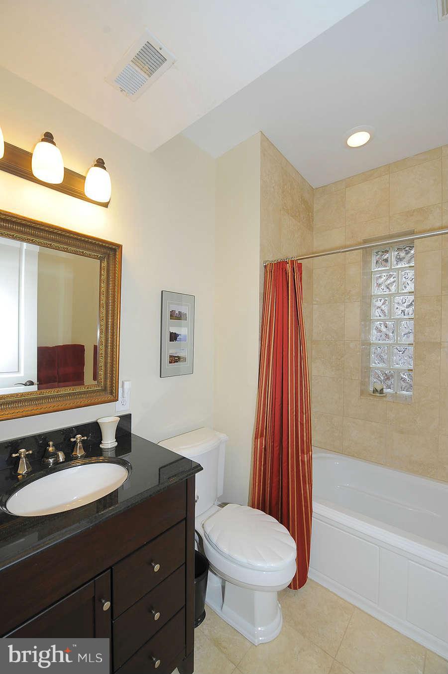 629 4th Street Northeast, Unit 3 Washington, DC 20002 - Photo 21 of 30 a bathroom with a sink and a mirror