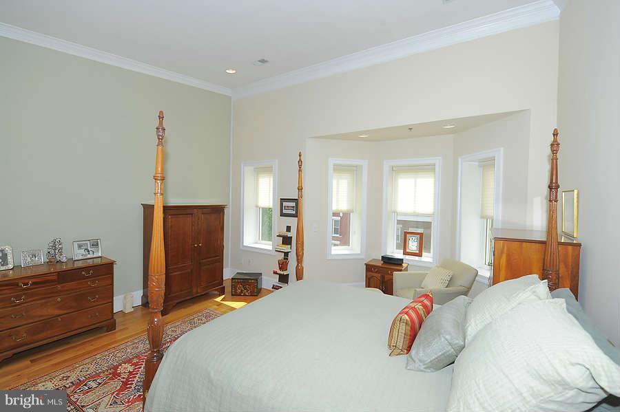 629 4th Street Northeast, Unit 3 Washington, DC 20002 - Photo 23 of 30 a bedroom with a bed and a dresser