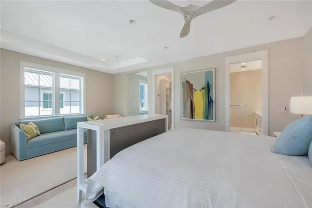 a bedroom with a bed and a couch