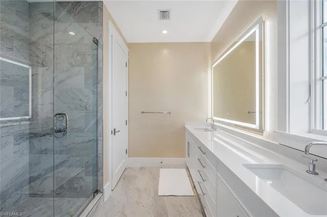 a bathroom with a bathtub and a sink