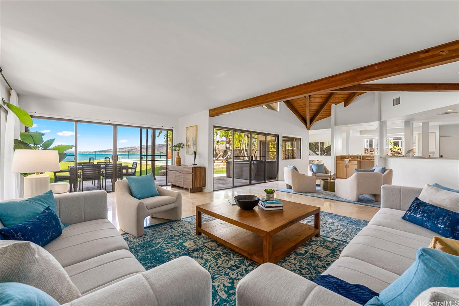 335 Portlock Road Honolulu, HI 96825 - Photo 1 of 1 a living room with furniture and a large window