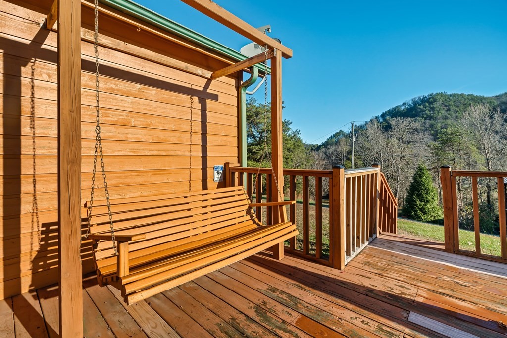 2617 Sharpes Ridge Way Sevierville, TN 37876 - Photo 9 of 43 a view of a balcony with wooden floor and fence