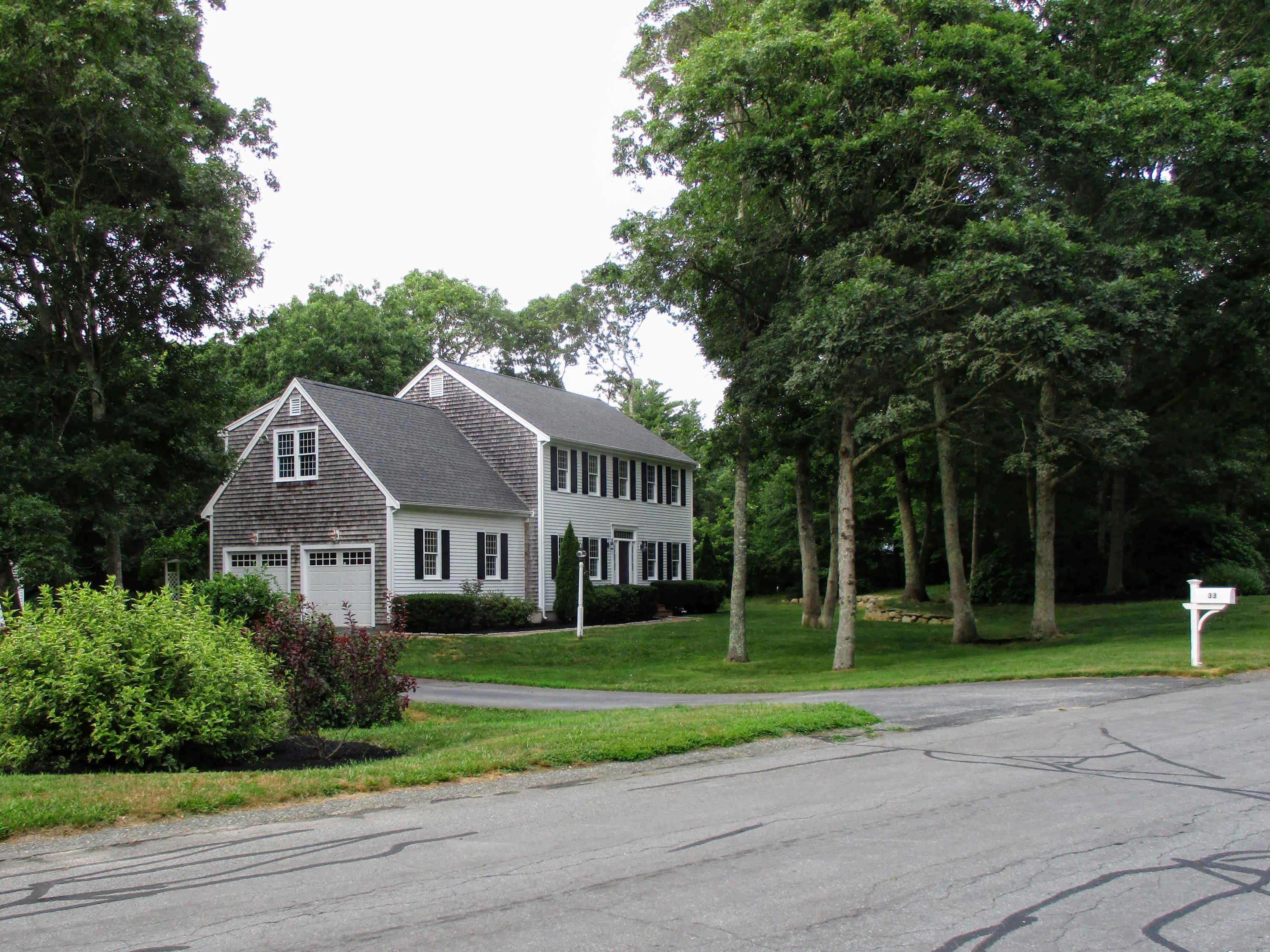 33 Highfield Drive Sandwich, MA 02563 - Photo 2 of 16 a front view of house with yard and green space