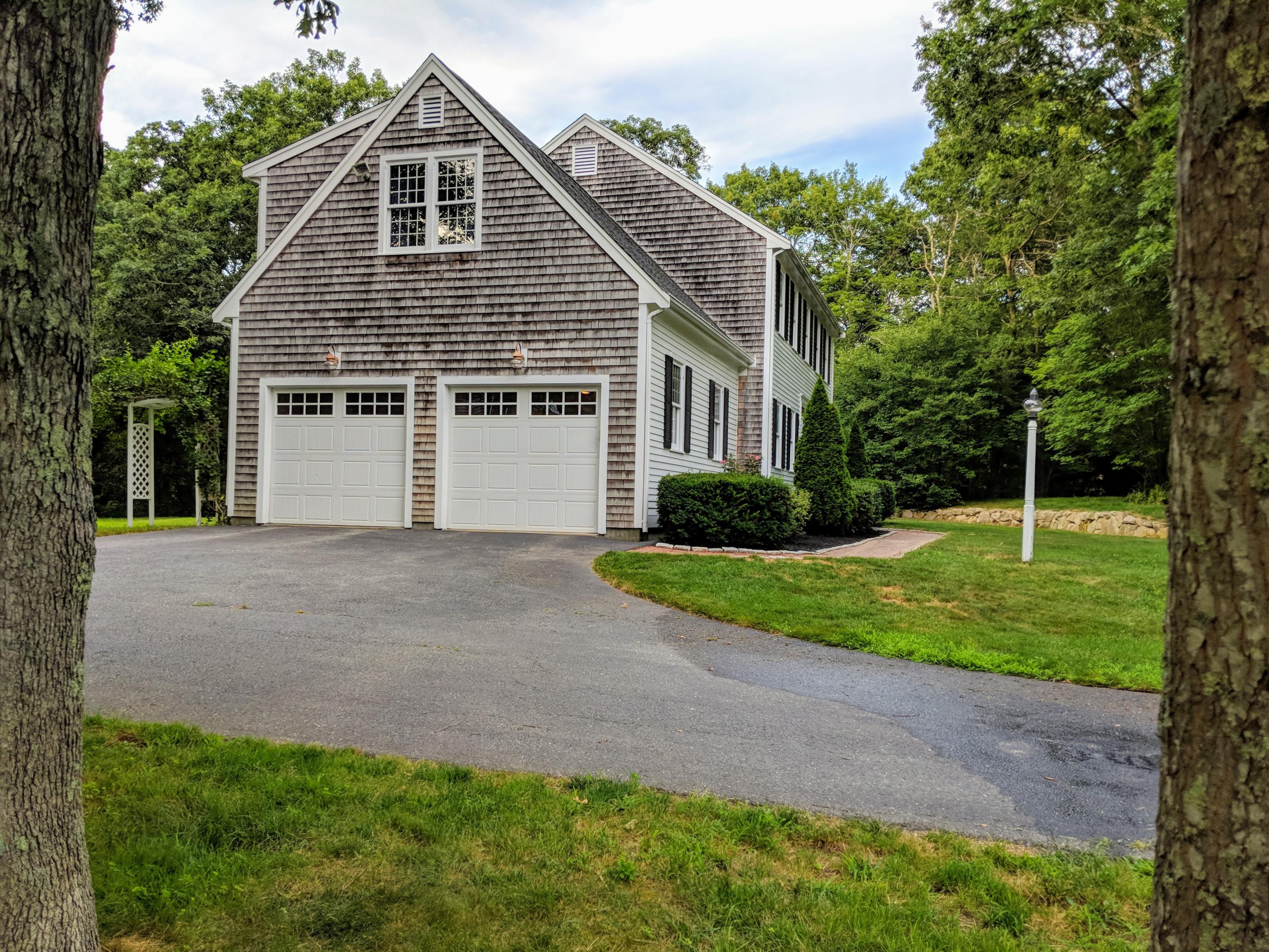 33 Highfield Drive Sandwich, MA 02563 - Photo 3 of 16 a view of a house with a yard and potted plants