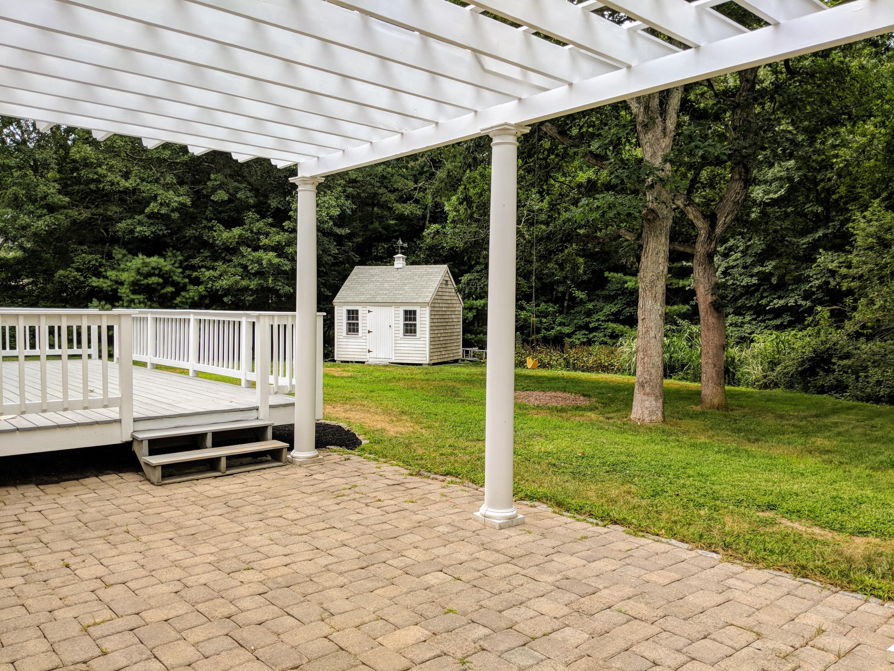 33 Highfield Drive Sandwich, MA 02563 - Photo 4 of 16 a view of a deck with a backyard