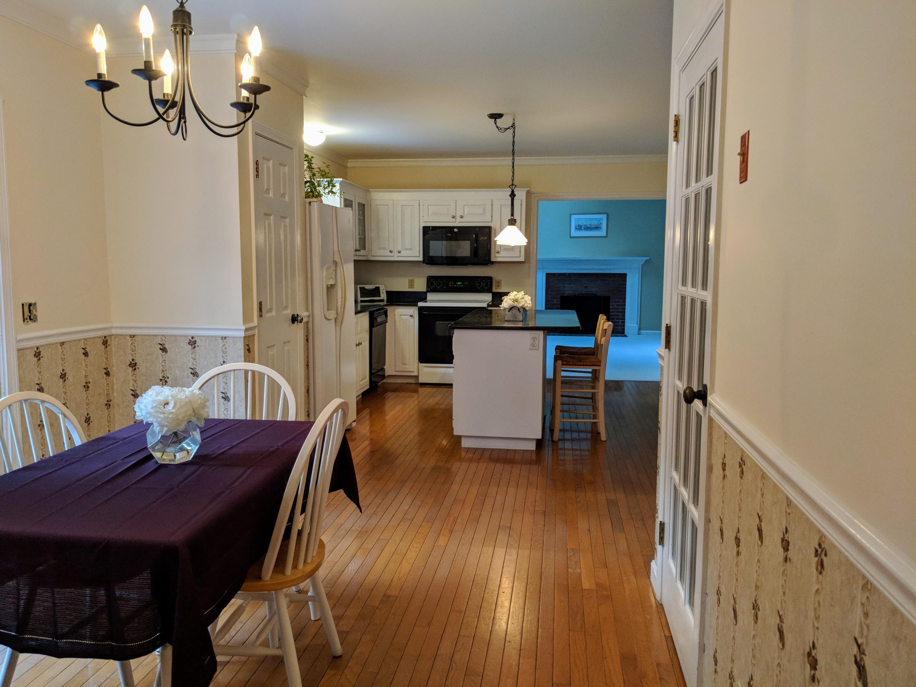 33 Highfield Drive Sandwich, MA 02563 - Photo 5 of 16 a view of a dining room with furniture and wooden floor