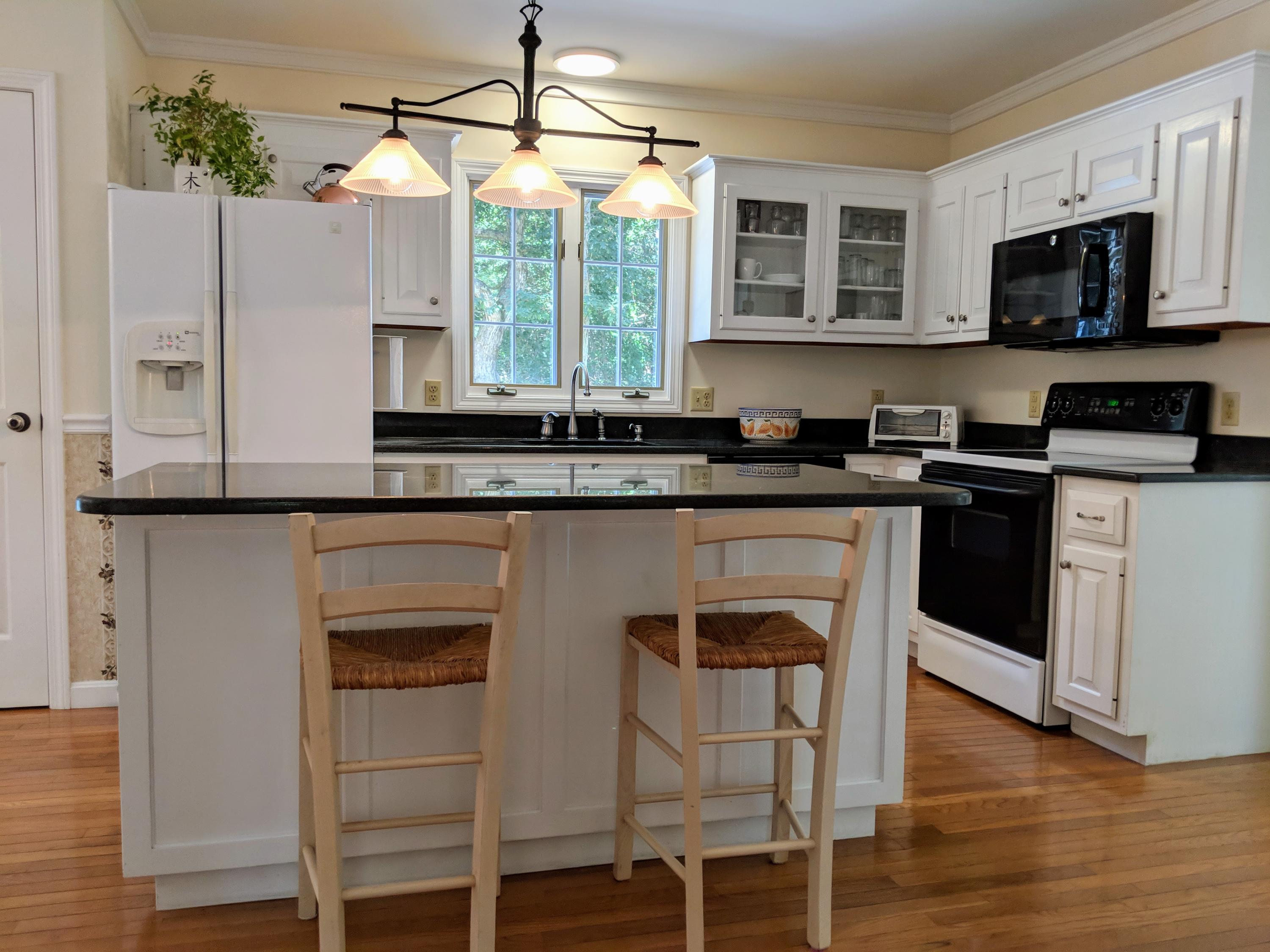 33 Highfield Drive Sandwich, MA 02563 - Photo 7 of 16 a kitchen with stainless steel appliances granite countertop a stove and a microwave