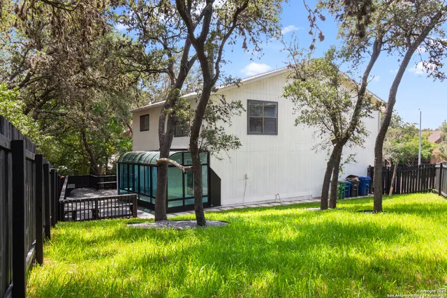 a view of a backyard with a small cabin