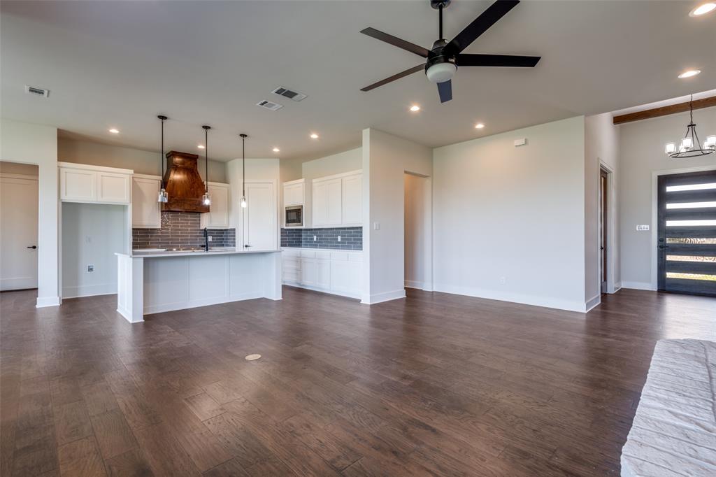 815 Evergreen Way Nevada, TX 75173 - Photo 12 of 38 a view of kitchen with wooden floor and window