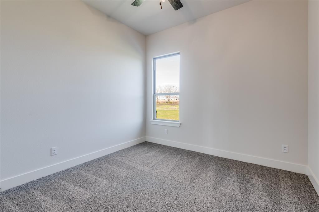815 Evergreen Way Nevada, TX 75173 - Photo 17 of 38 an empty room with a window