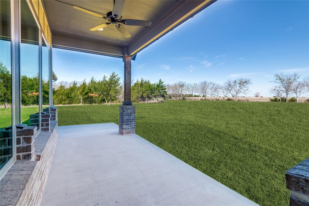 815 Evergreen Way Nevada, TX 75173 - Photo 3 of 38 a view of a backyard with table and chairs