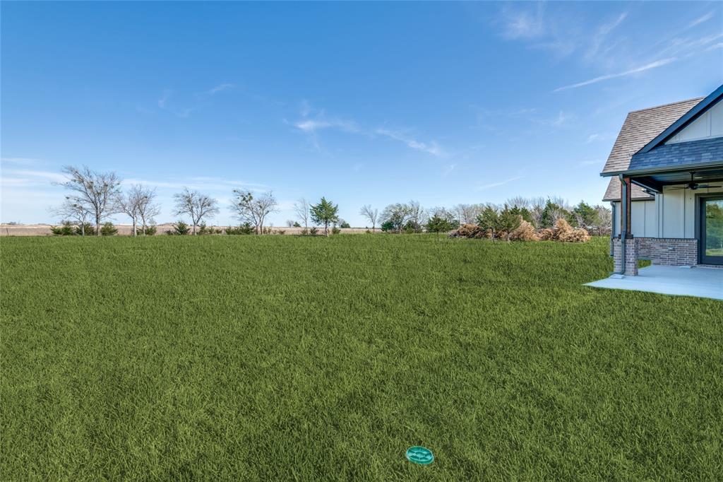 815 Evergreen Way Nevada, TX 75173 - Photo 33 of 38 a view of a table and chairs in the green field