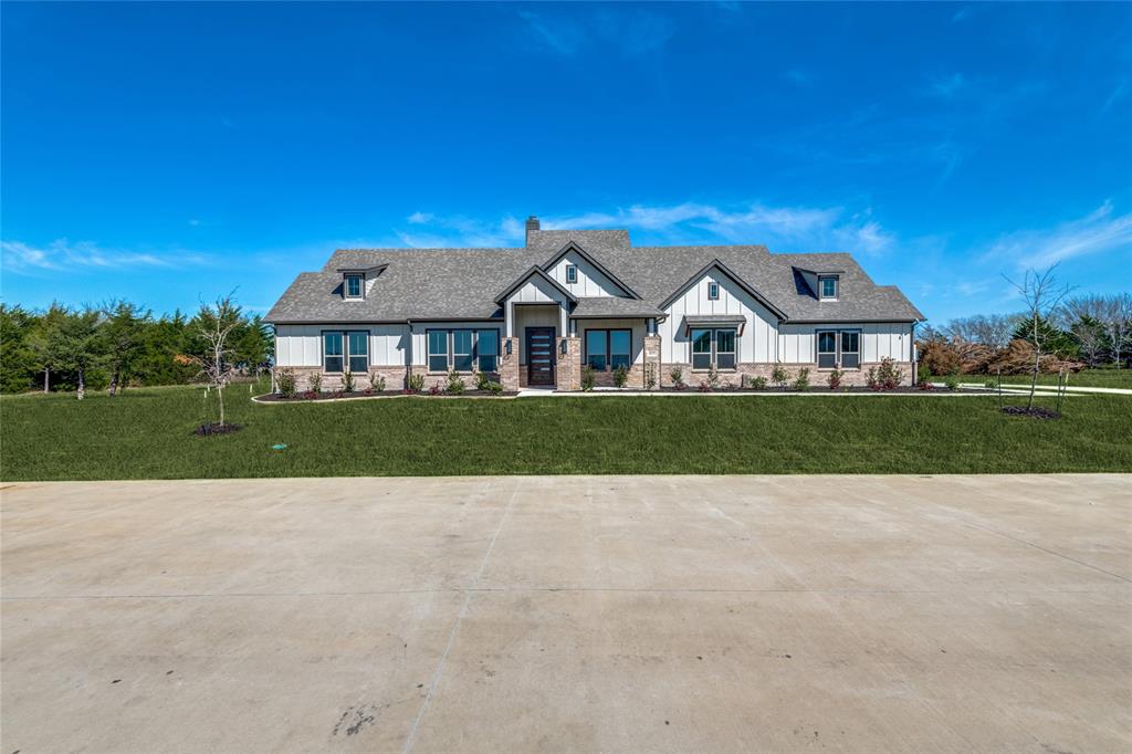815 Evergreen Way Nevada, TX 75173 - Photo 35 of 38 a view of house with garden and tall trees