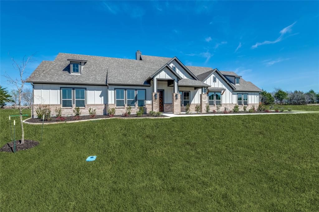 815 Evergreen Way Nevada, TX 75173 - Photo 36 of 38 a front view of a house with a yard