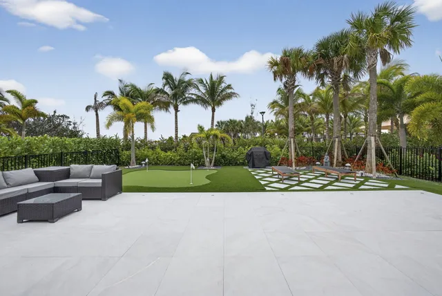 a view of a garden with palm trees