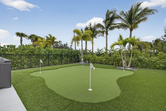 a view of a swimming pool with a yard