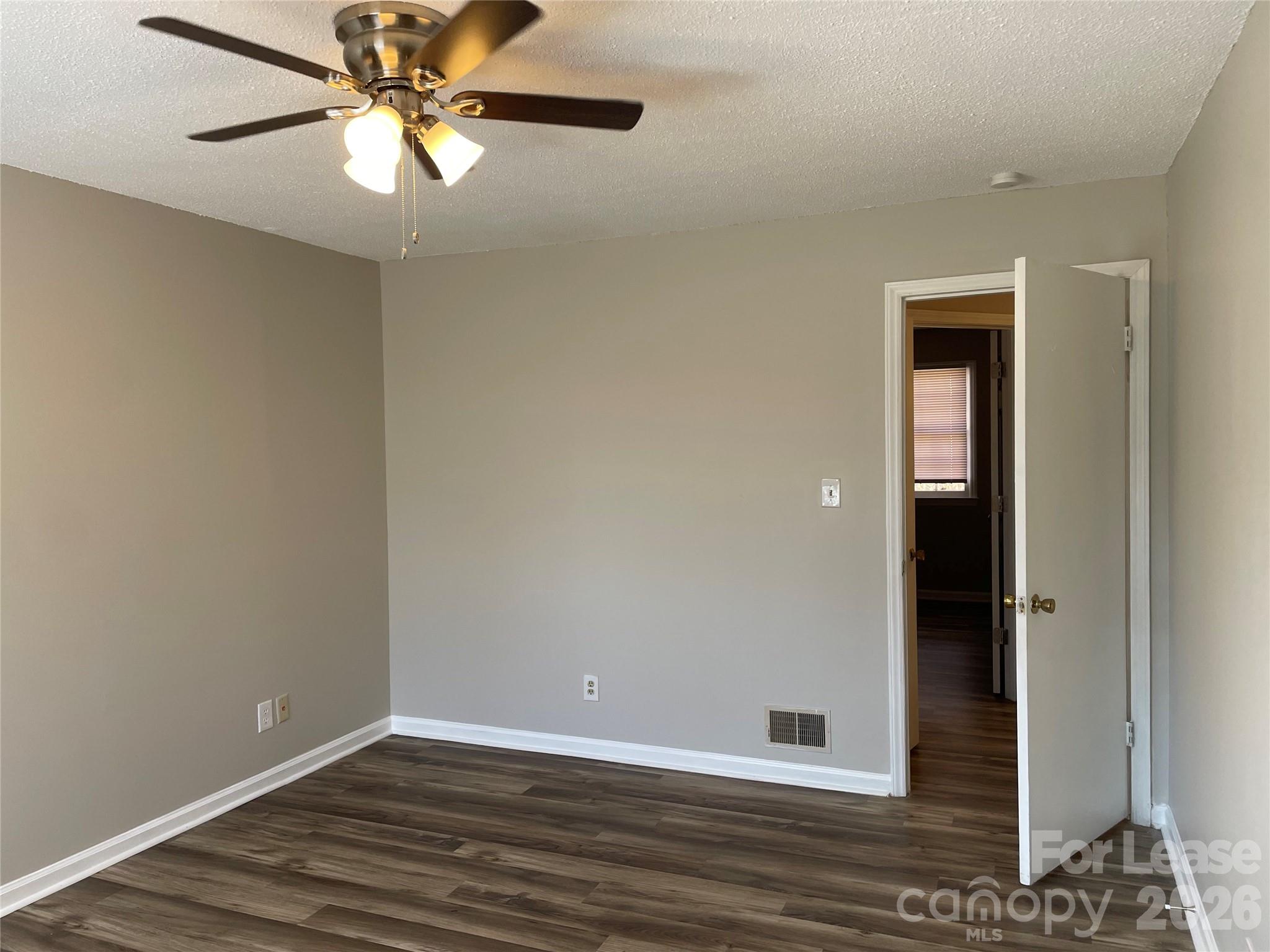 118 Ross Street, Unit B2 Morganton, NC 28655 - Photo 13 of 19 a view of an empty room with wooden floor