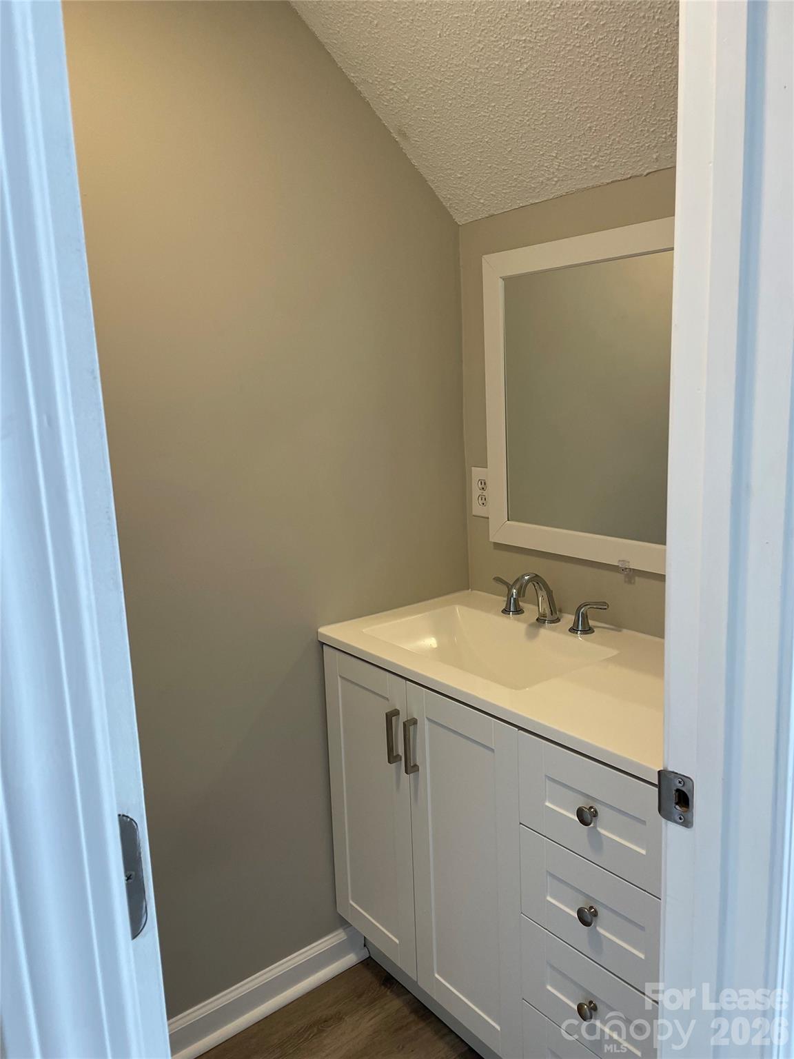118 Ross Street, Unit B2 Morganton, NC 28655 - Photo 10 of 19 a bathroom with a sink and a mirror