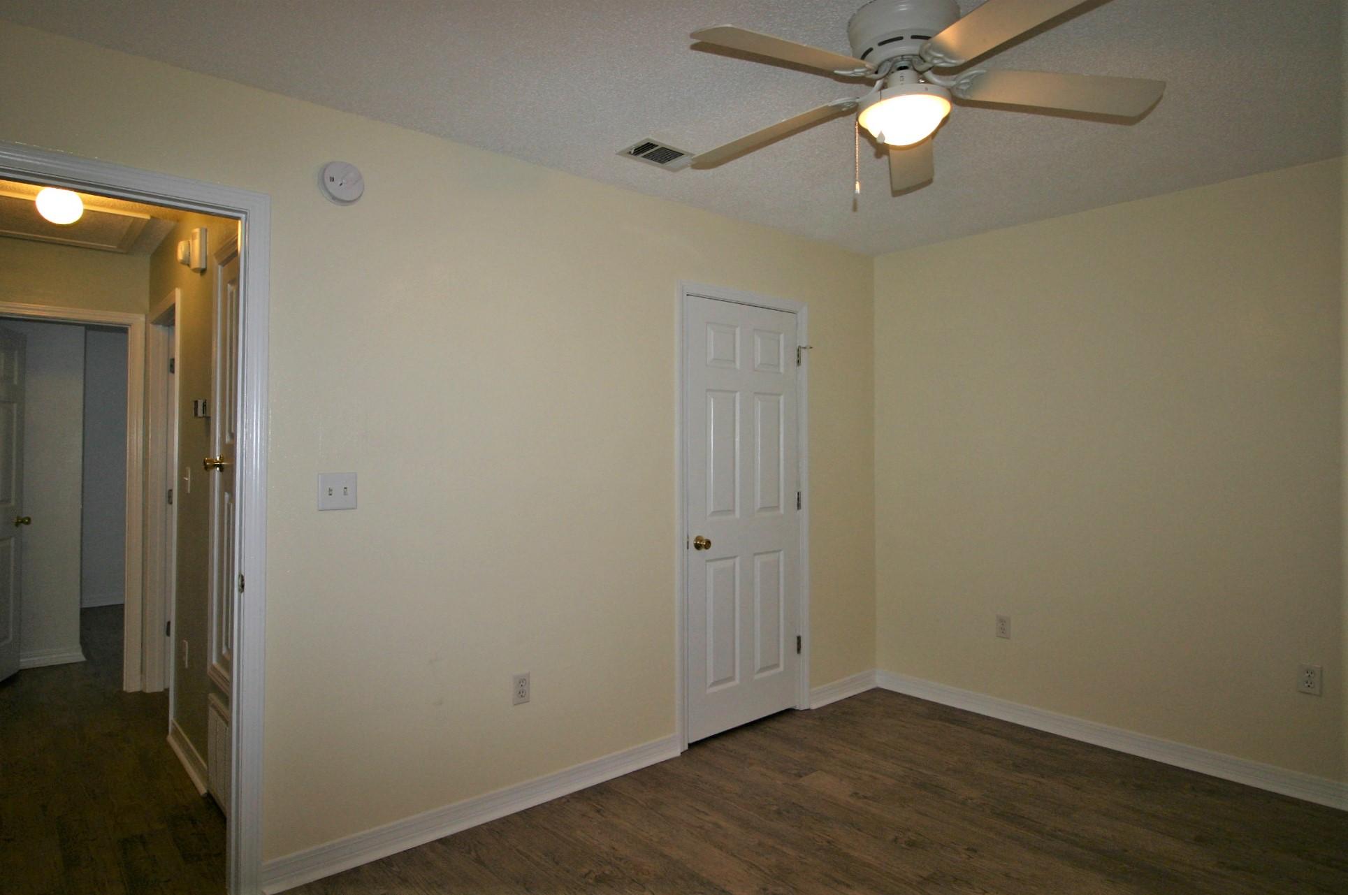 532 Brock Avenue Crestview, FL 32539 - Photo 10 of 10 an empty room with wooden floor and a ceiling fan