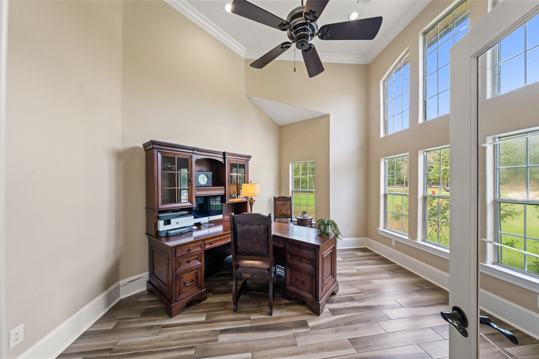 32660 Willow Bend Road Waller, TX 77484 - Photo 15 of 47 Dedicated office or study featuring abundant natural light, tall windows, high ceilings, and a ceiling fan.
