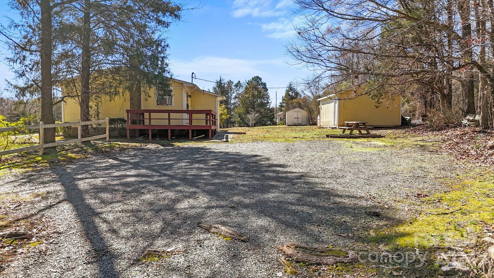 9813 Machado Drive Indian Trail, NC 28079 - Photo 19 of 27 a view of a house with a yard covered in snow