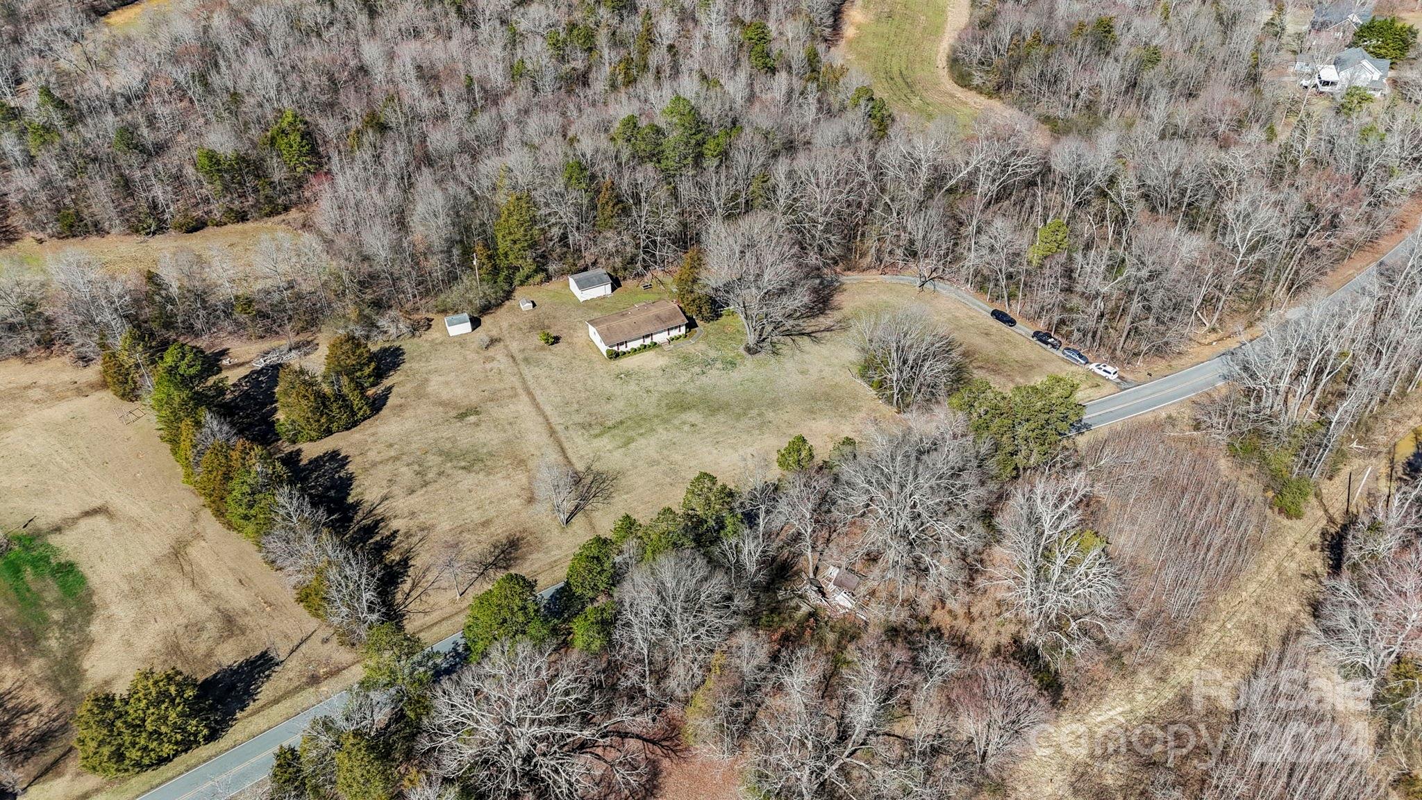 9813 Machado Drive Indian Trail, NC 28079 - Photo 25 of 27 a view of a dry yard with trees