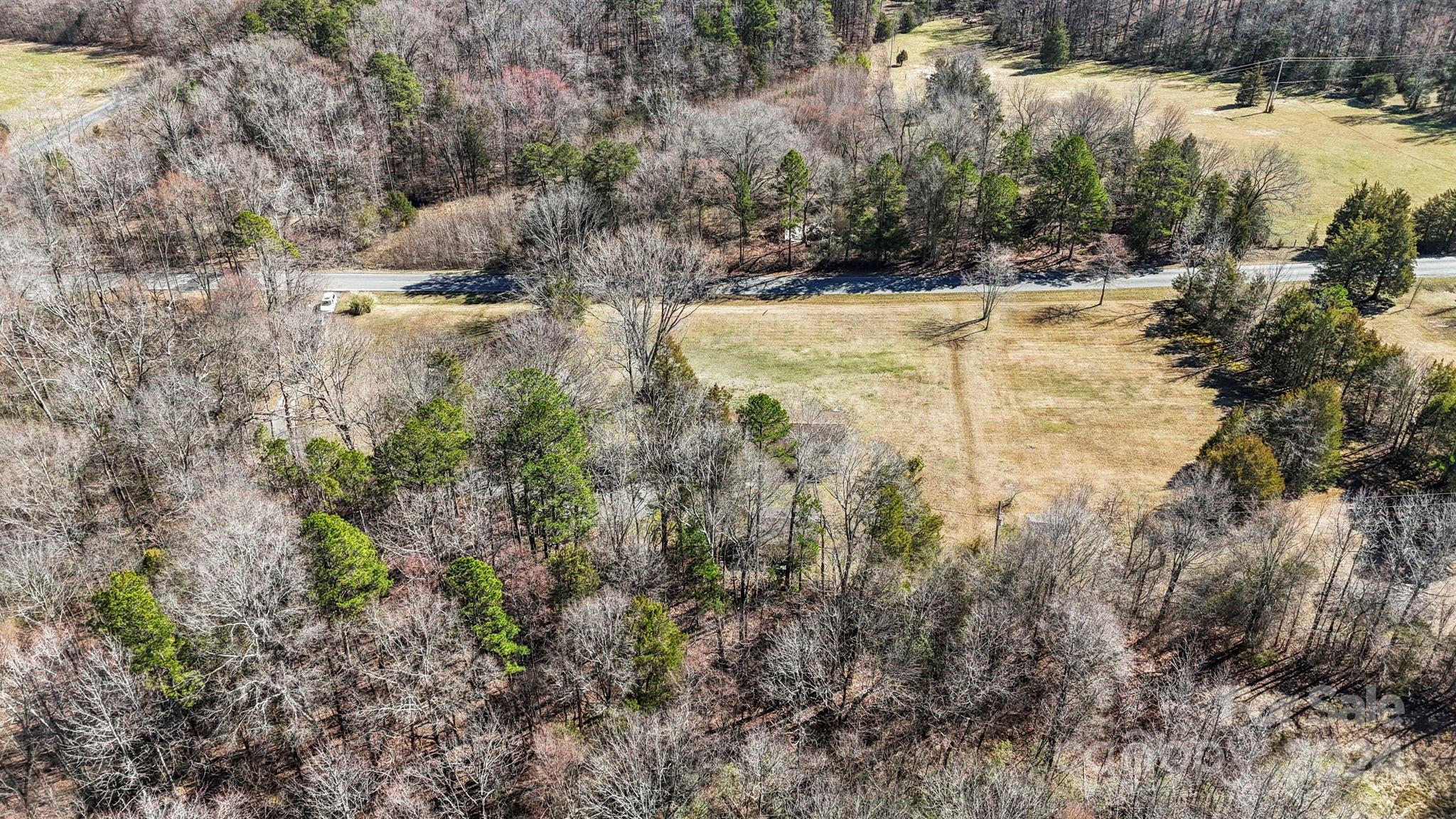 9813 Machado Drive Indian Trail, NC 28079 - Photo 27 of 27 a view of a yard with trees