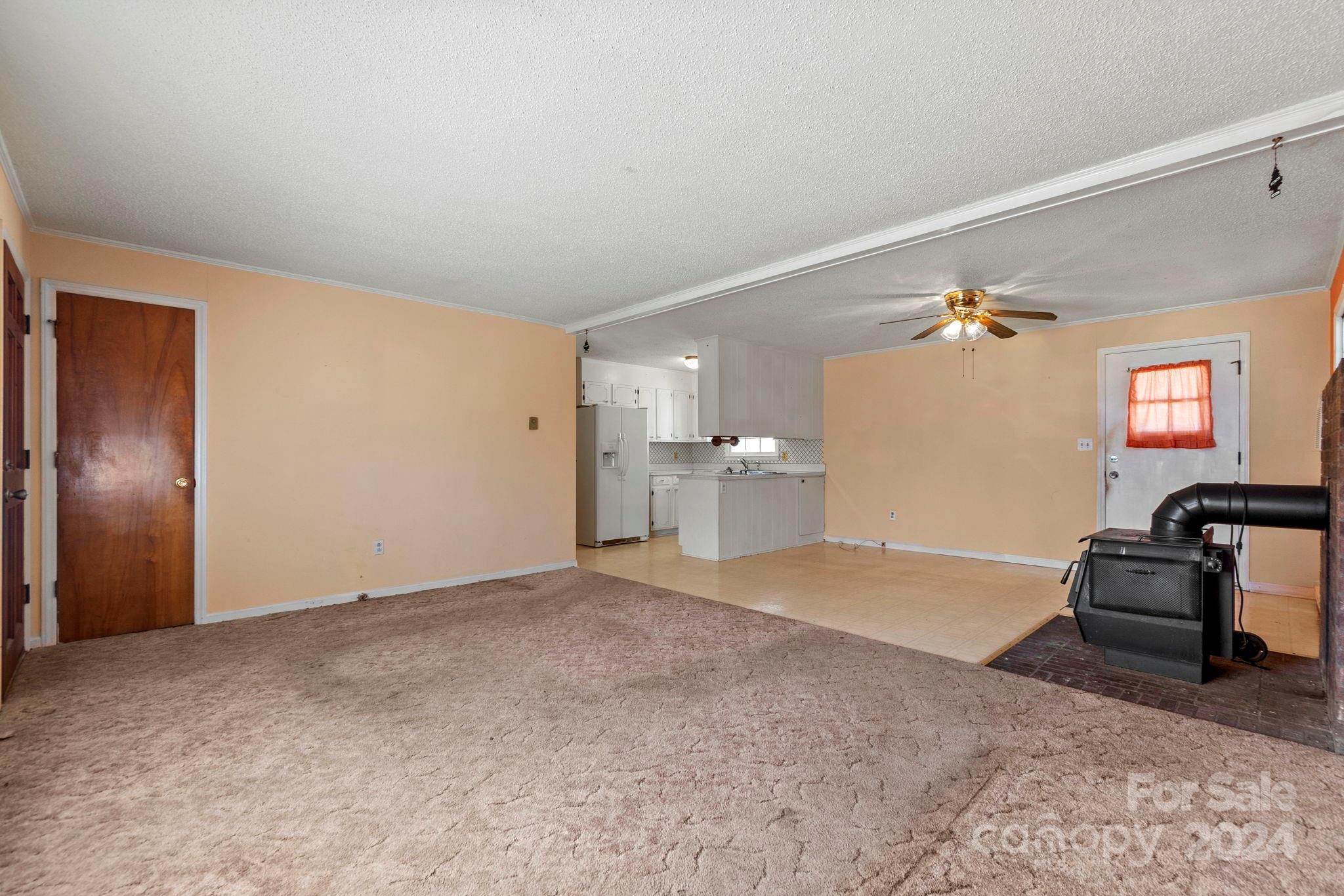 9813 Machado Drive Indian Trail, NC 28079 - Photo 6 of 27 a view of a livingroom with furniture and a flat screen tv