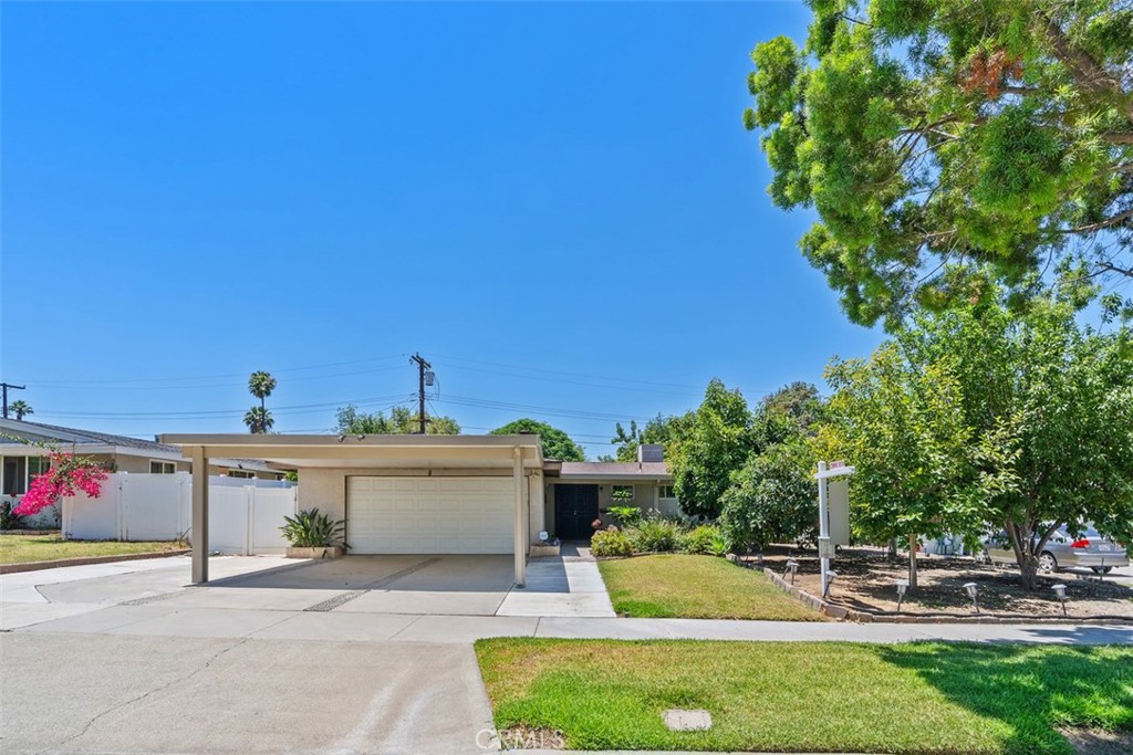 8897 Amber Street Riverside, CA 92503 - Photo 1 of 1 a front view of a house with a yard