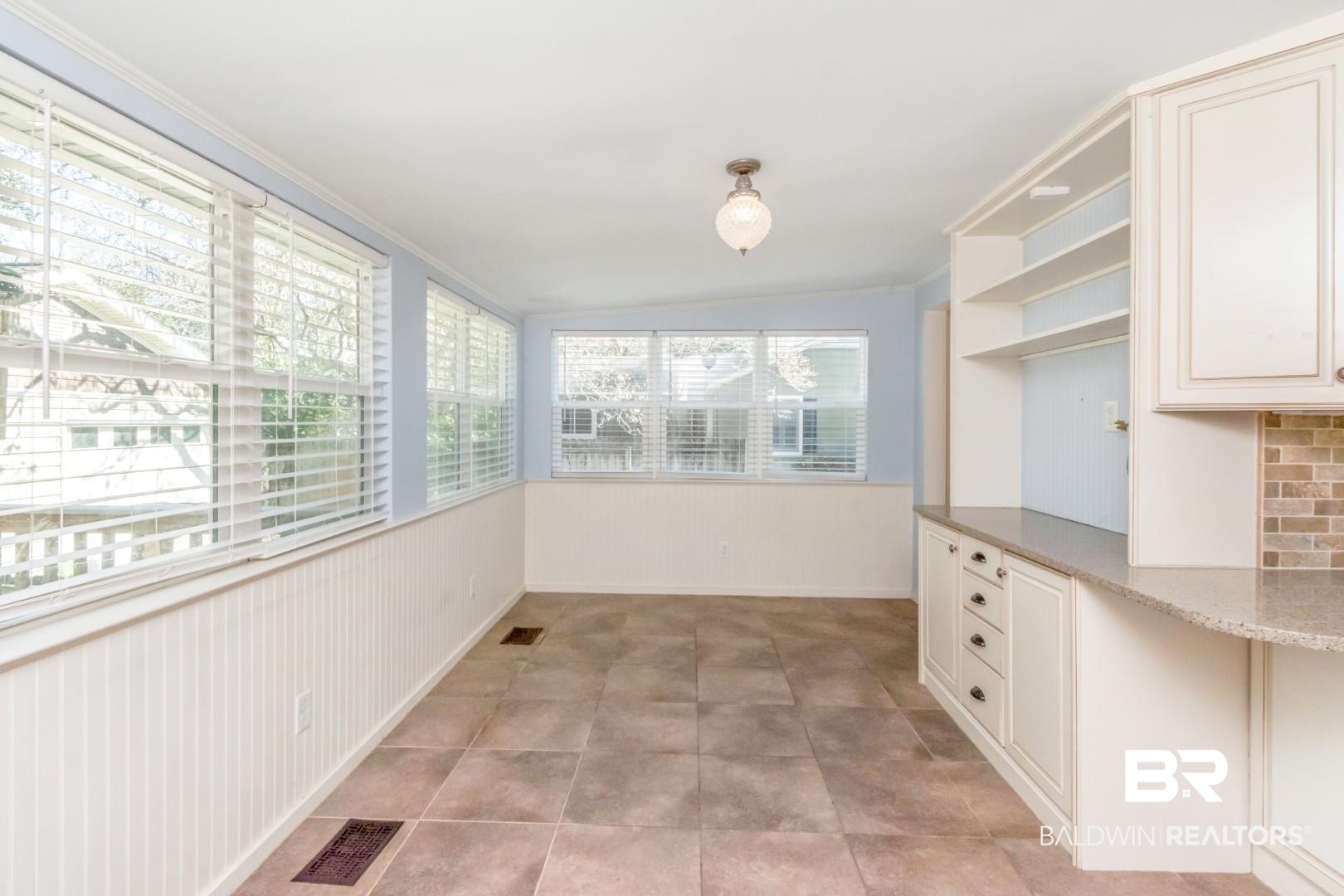 10 South Hathaway Road Mobile, AL 36608 - Photo 13 of 46 Unfurnished dining area with lofted ceiling and baseboards