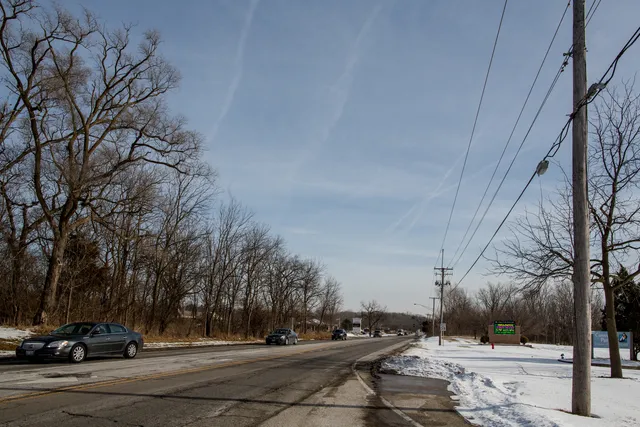 a street sign on a pole on a road