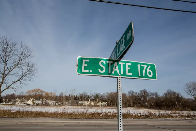 a view of city street with cars