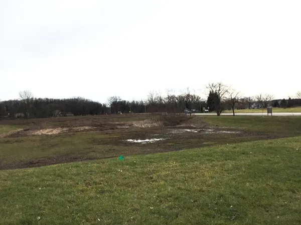 a view of outdoor space with river and trees